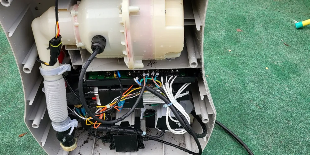 Inflatable hot tub pump opened for repair assessment